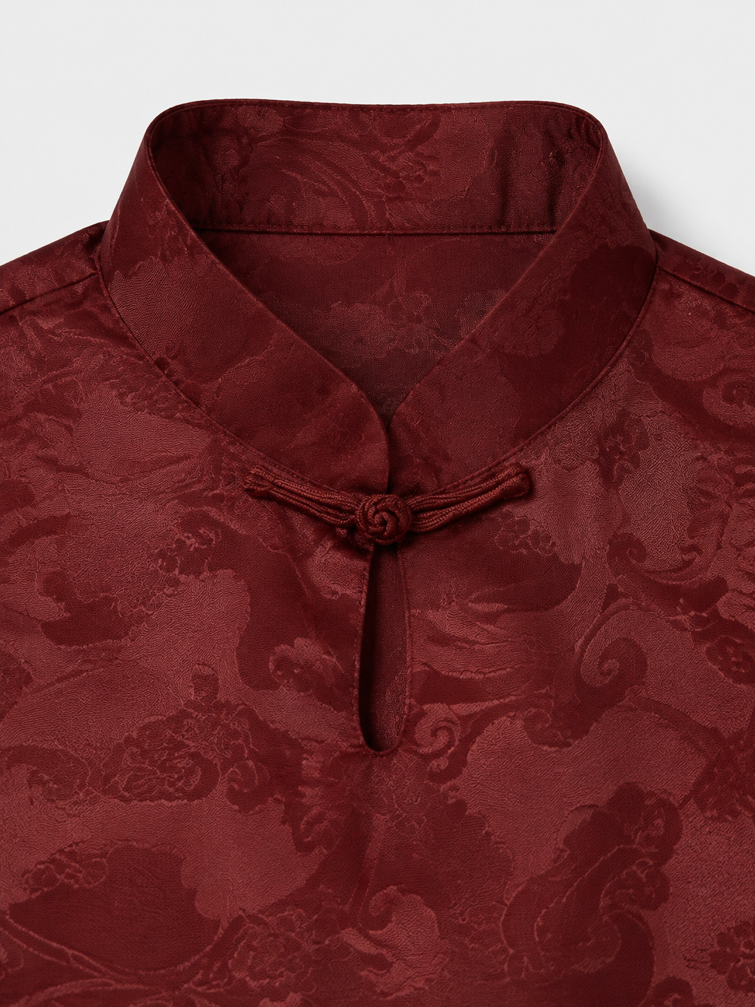 Mandarin collar and knotted button detail