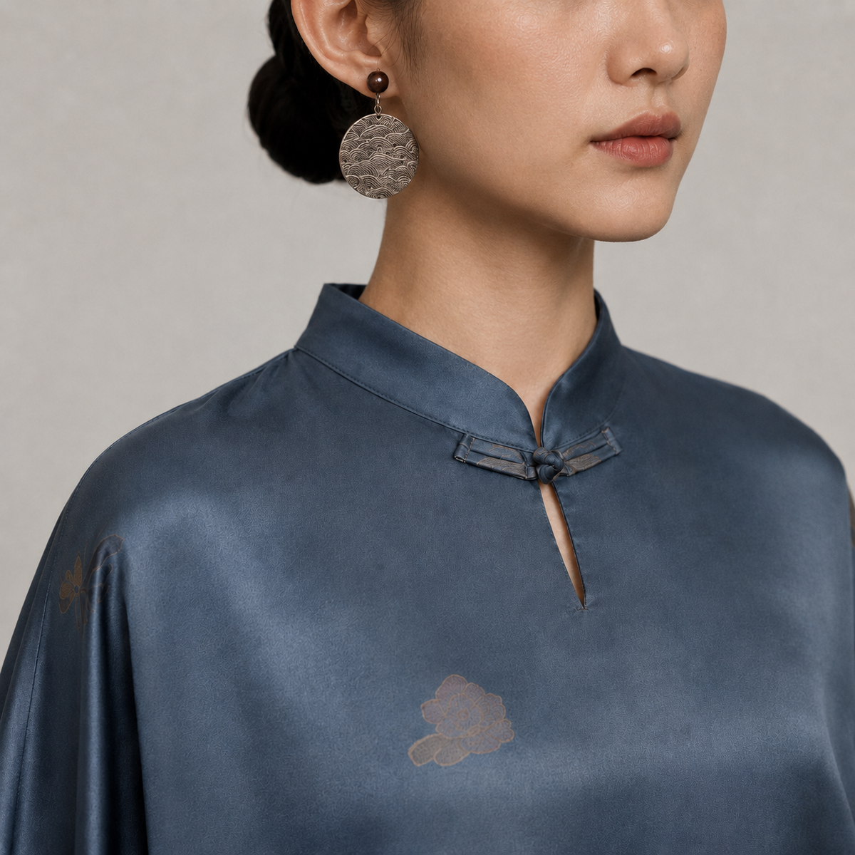 Mandarin collar and frog closure detail