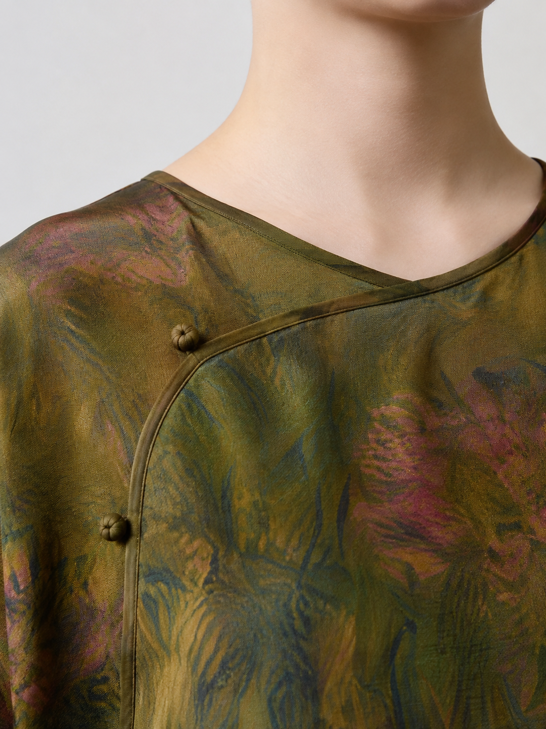 Neckline and frog closure detail